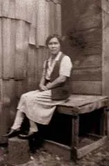 Mother sitting on porch at Lemon Creek